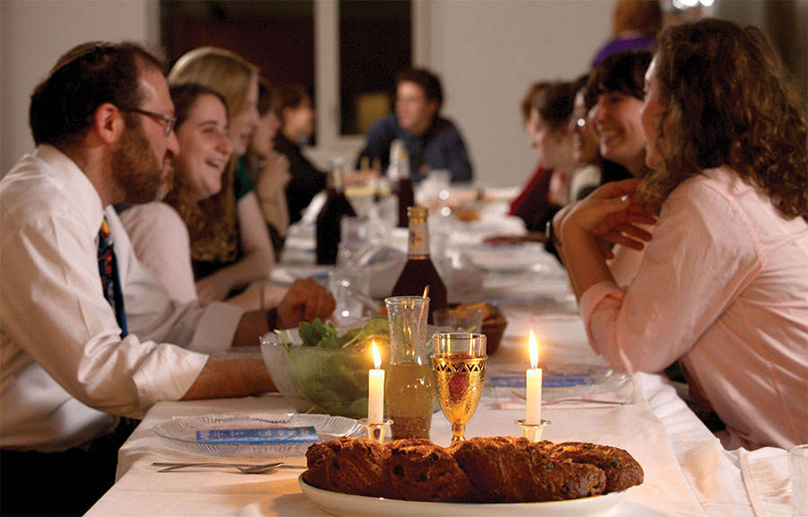 People gathered around a Shabbat table